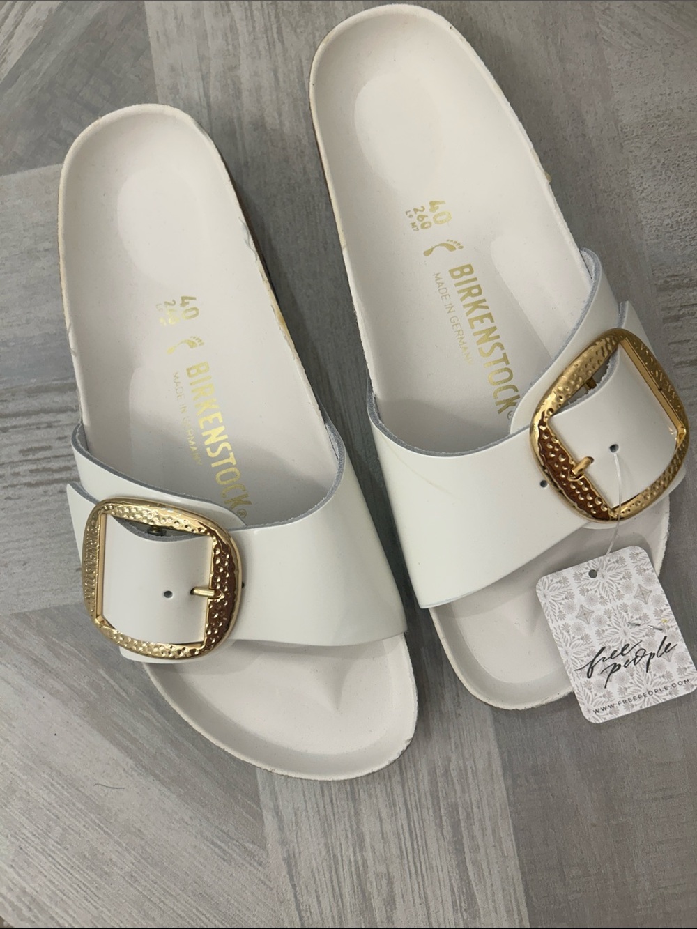 Birkenstock White Slide Sandals with Gold Buckle